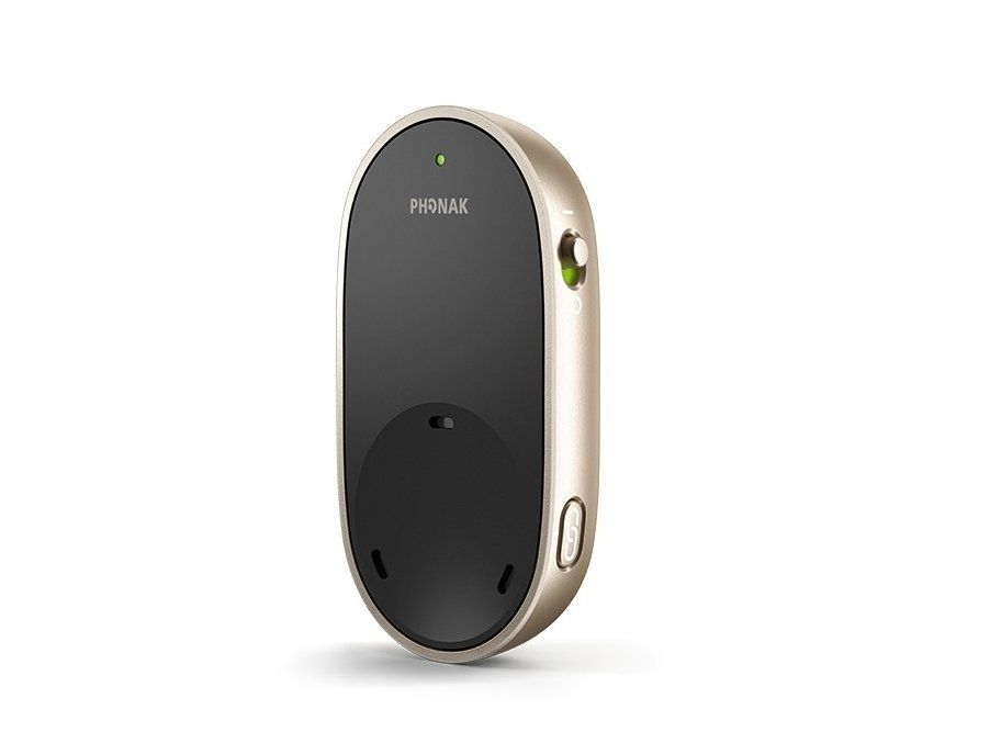 Oval-shaped beige and black device with a button and small light; possibly a remote control.