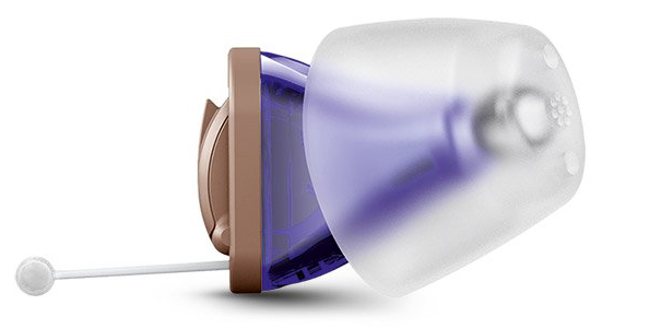 Tan and purple hearing aid with clear ear dome.