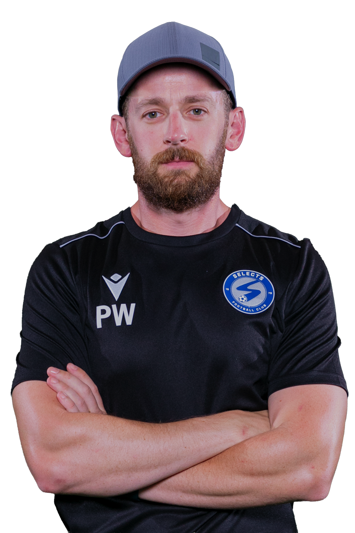 Man in black sports shirt and cap, arms crossed, standing against a white background.