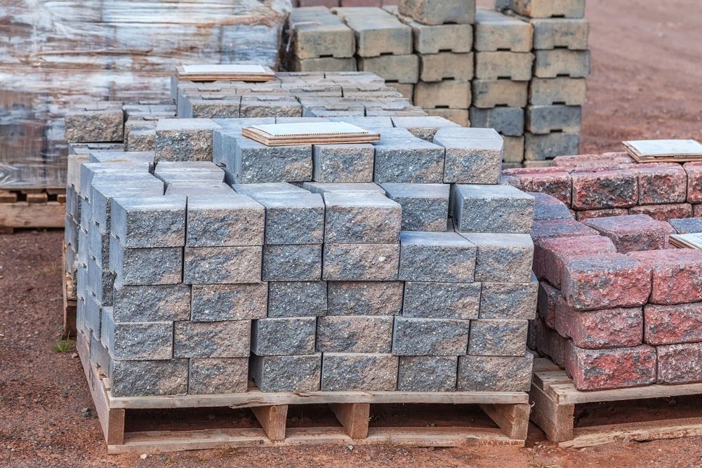 Pallets of Bricks in Various Colors, Stacked Outdoors — Grafton Concreting & Bobcat Services In South Grafton, NSW