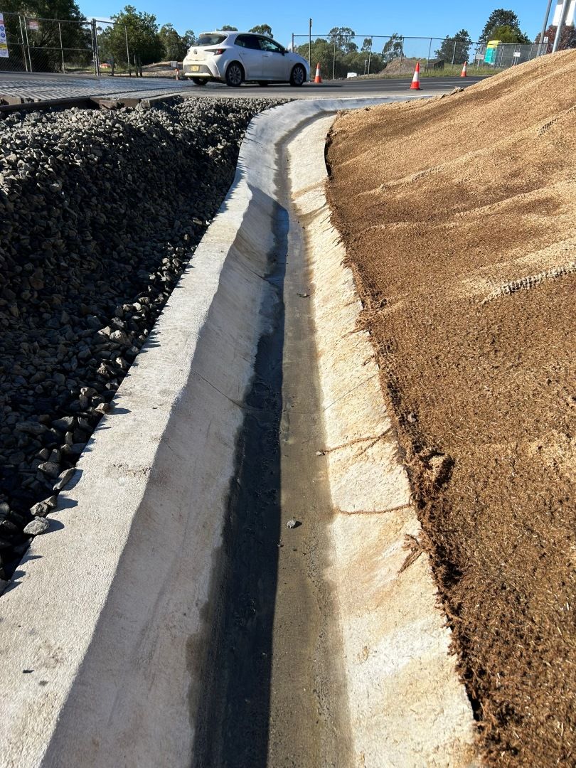 Concrete Next to a Roadside — Grafton Concreting & Bobcat Services In South Grafton, NSW