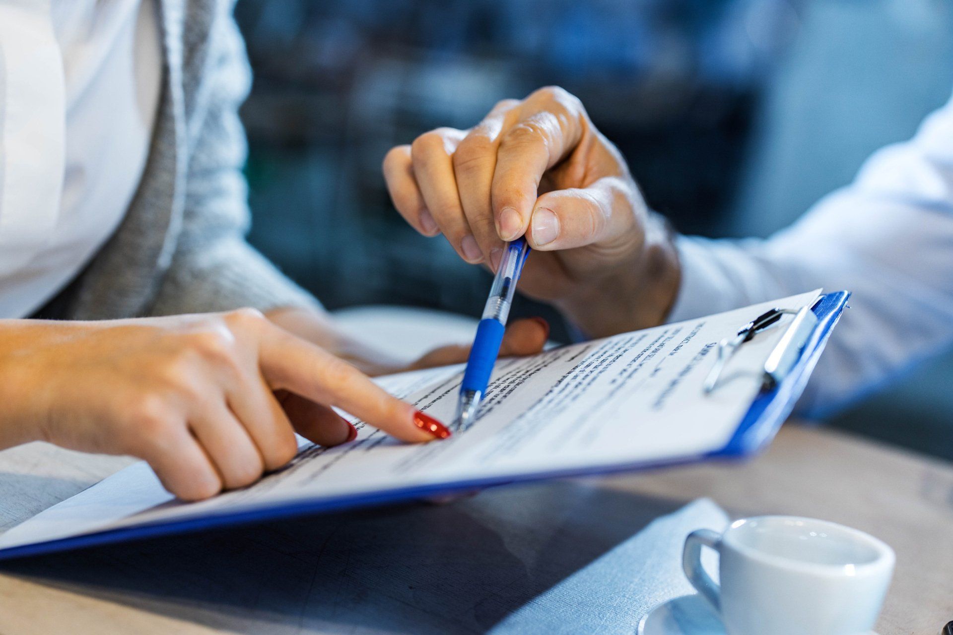 Insurance Agent Showing His Customer Where To Sign The Contract - Albuquerque, NM - Credit Rescue Inc. Insurance Agent Showing His Customer Where To Sign The Contract - Albuquerque, NM - Credit Rescue Inc.