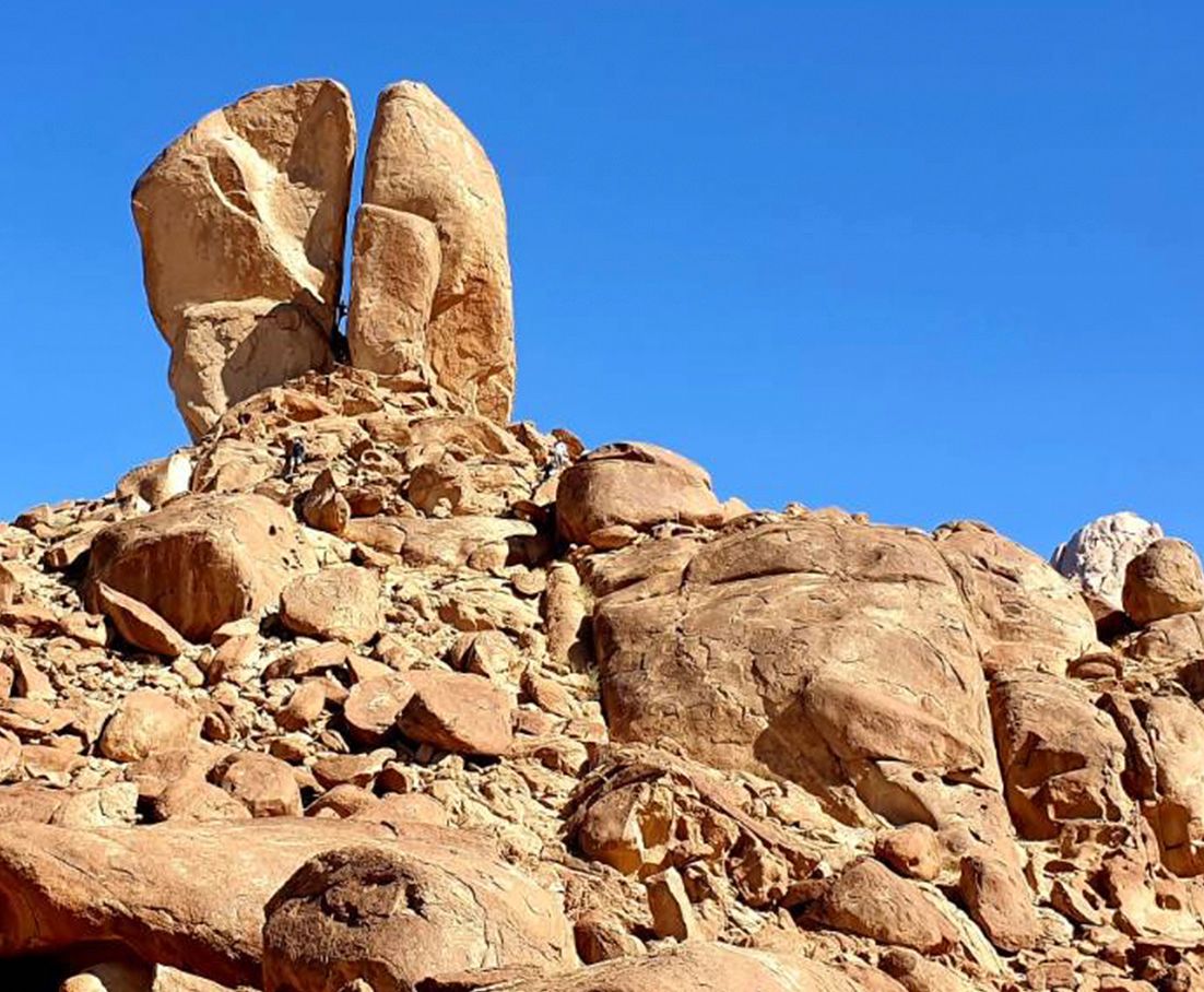 The Split Rock of Moses at Rephadim desert with a blue sky in the background