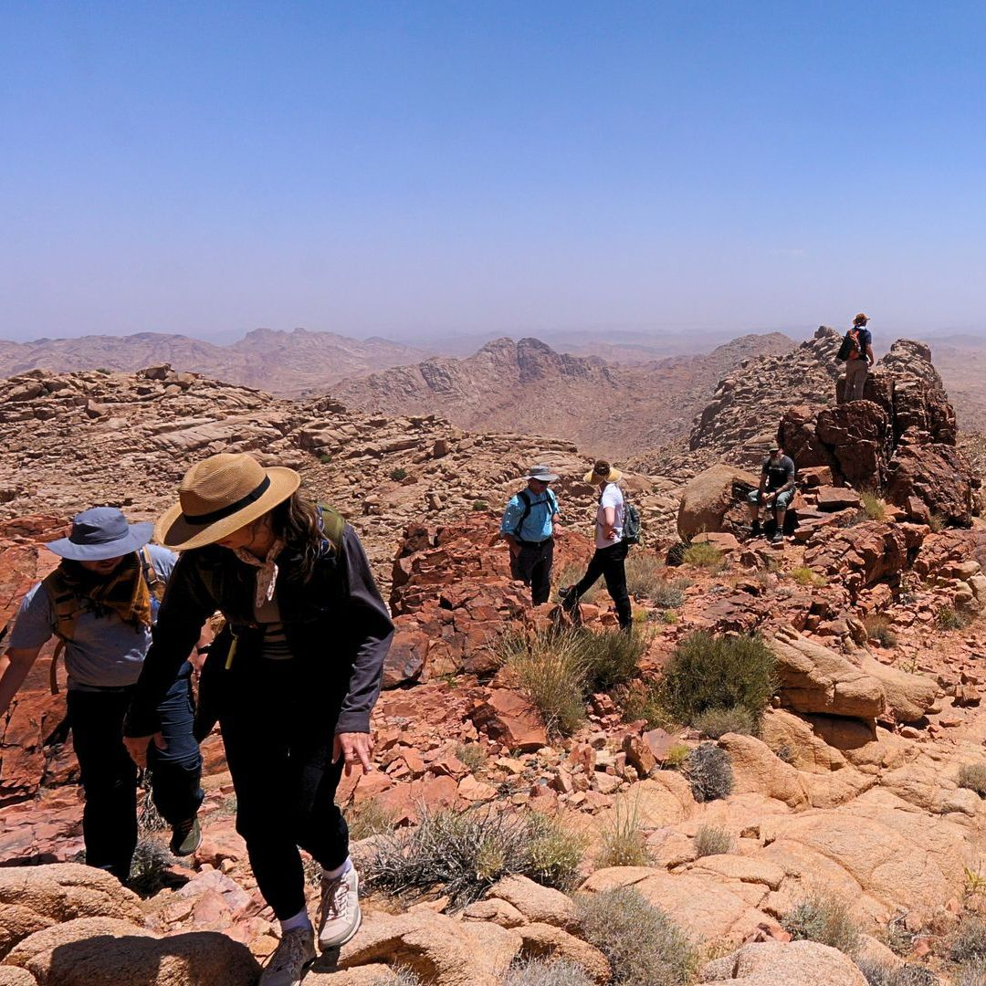 A group of people are hiking up the Real Mount Sinai