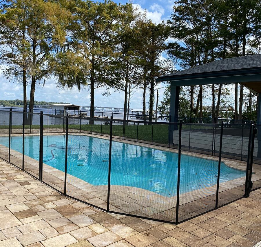A large swimming pool with a fence around it