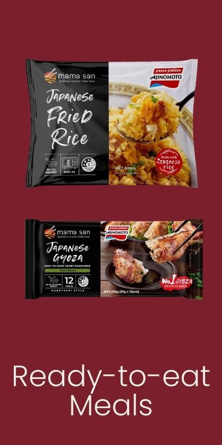 Two packaged meals, Japanese Fried Rice and Japanese Gyoza, displayed against a solid dark red background.