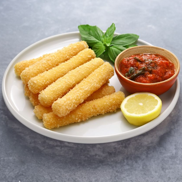 Mozzarella sticks with marinara sauce, lemon, and basil on a plate.