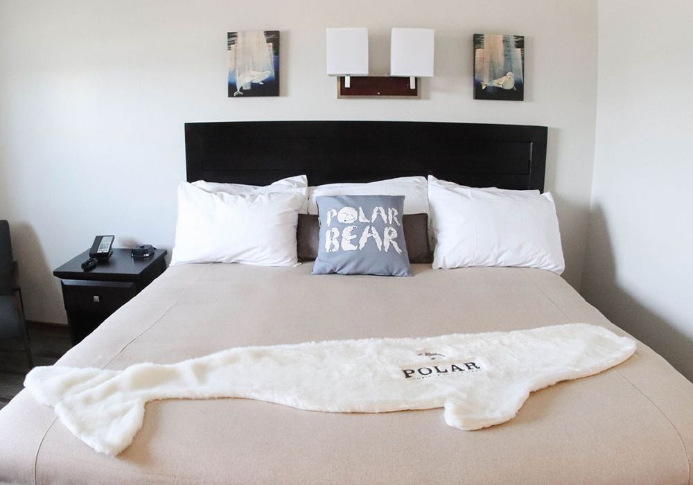 Bedroom with a bed, pillow reading