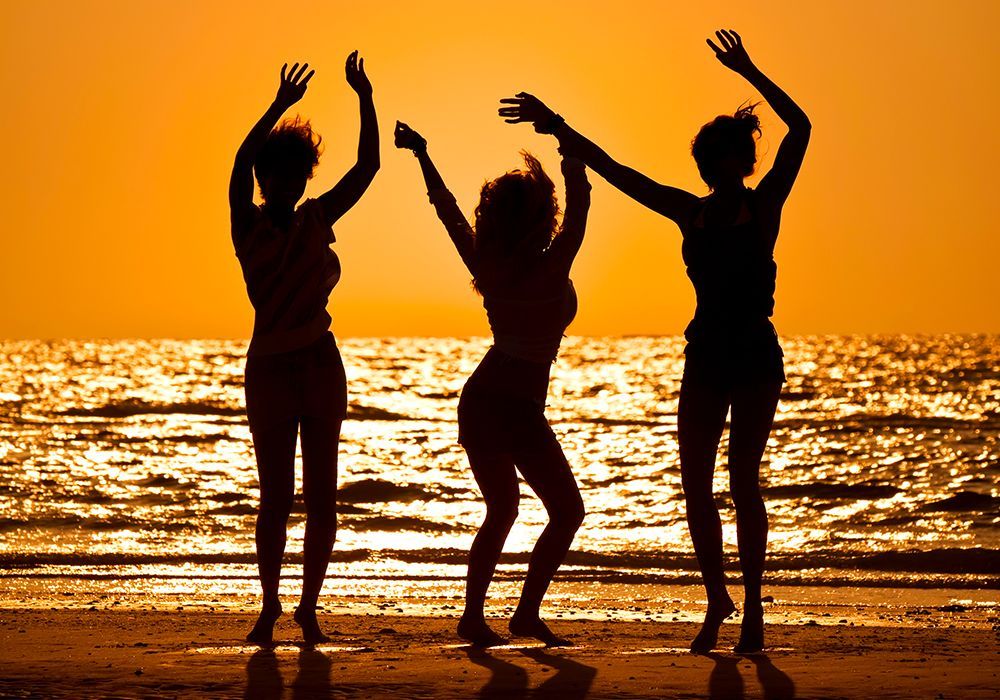 dancing on the beach women dancing on the beach