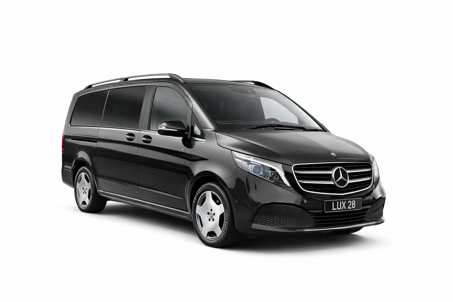 Black Mercedes-Benz van with silver rims, parked on a solid white background.