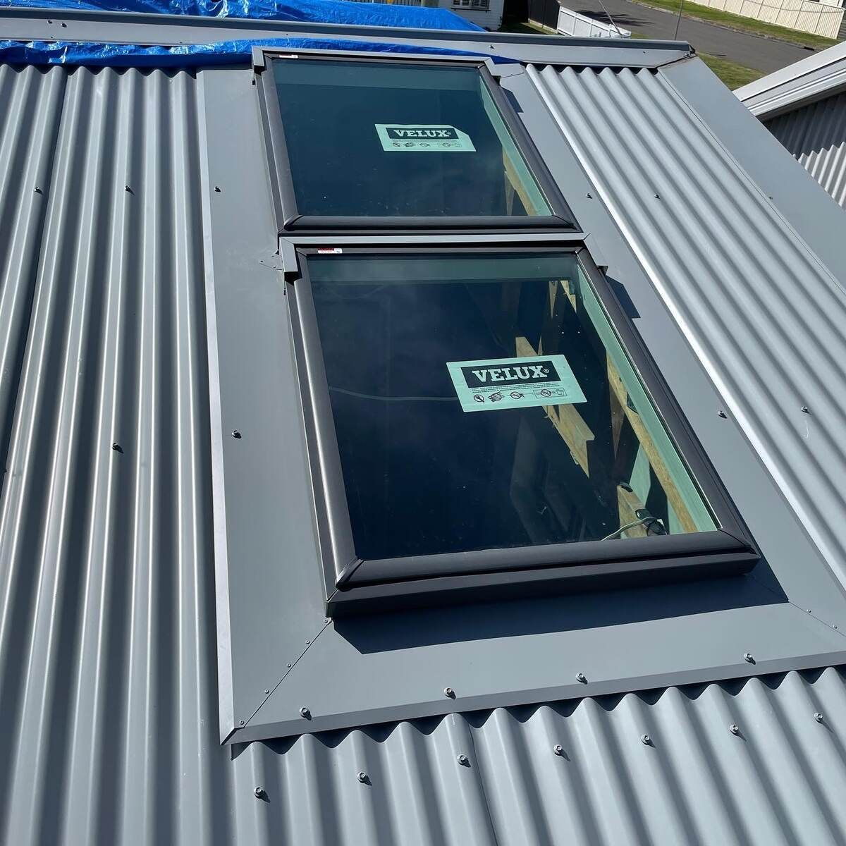 There Are Two Skylights On The Roof Of A Building — Elevated Roofing Systems Pty Ltd In Kiama, NSW
