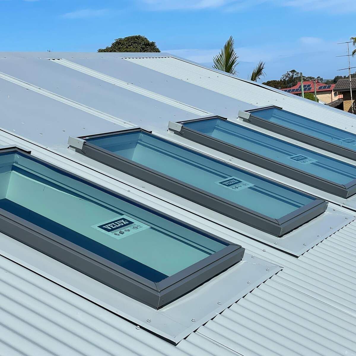 A Roof With A Lot Of Skylights On It — Elevated Roofing Systems Pty Ltd In Kiama, NSW