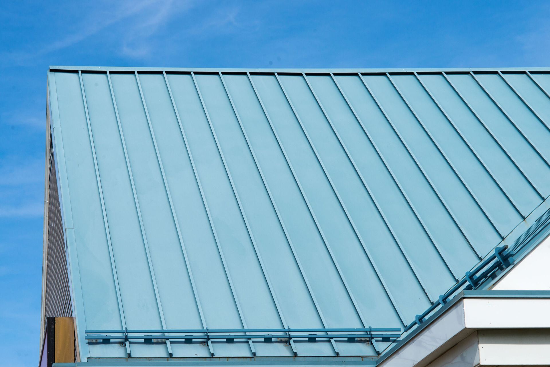 A Close Up Of A Blue Roof With A Blue Sky In The Background — Elevated Roofing Systems Pty Ltd In Shellharbour, NSW