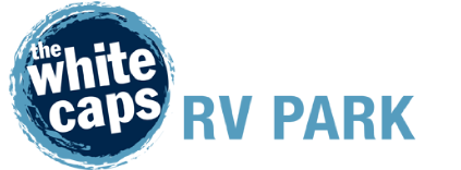The White Caps RV Park logo in white and light blue on a blue circular badge