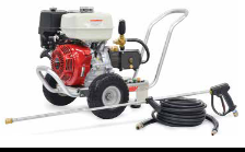 Portable pressure washer with red engine, black hose reel, and spray wand on a wheeled frame