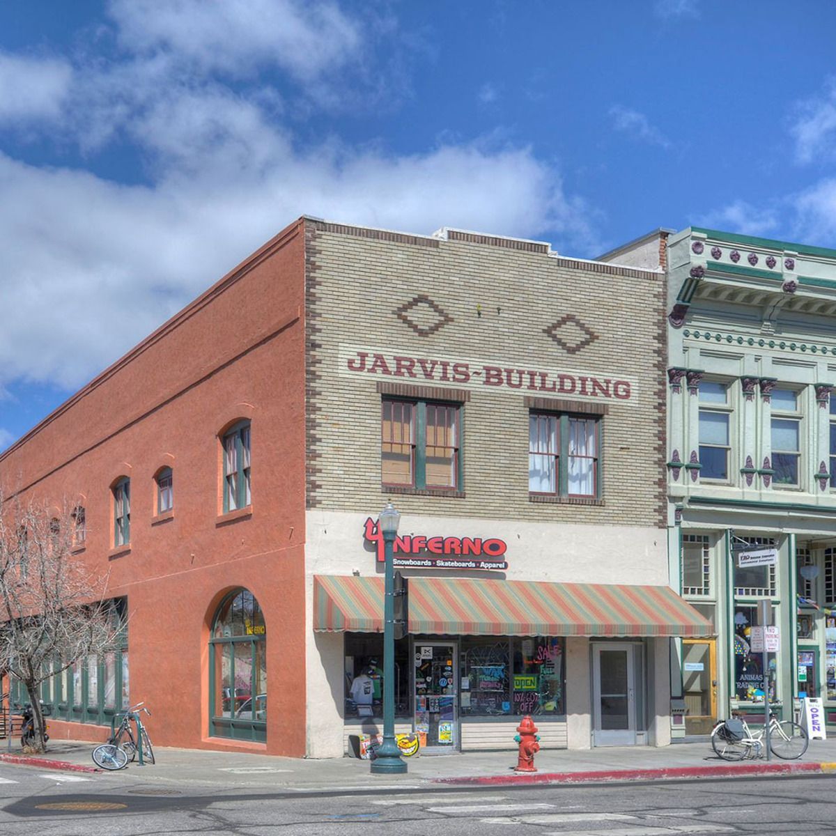 A photograph of a storefront with a 'Neeno' sign and a 'Jarvis Building' sign.