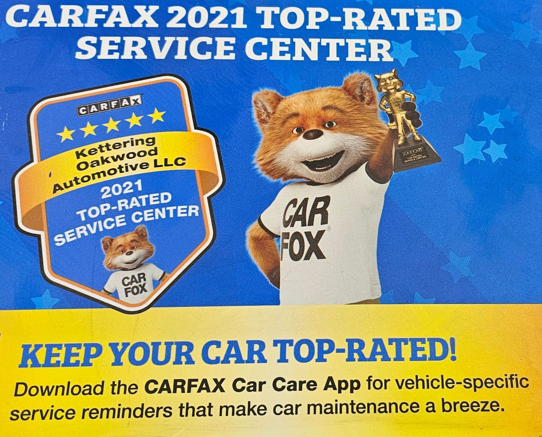 CARFAX 2021 Top-Rated Service Center ad featuring a bear mascot holding a trophy; blue background.