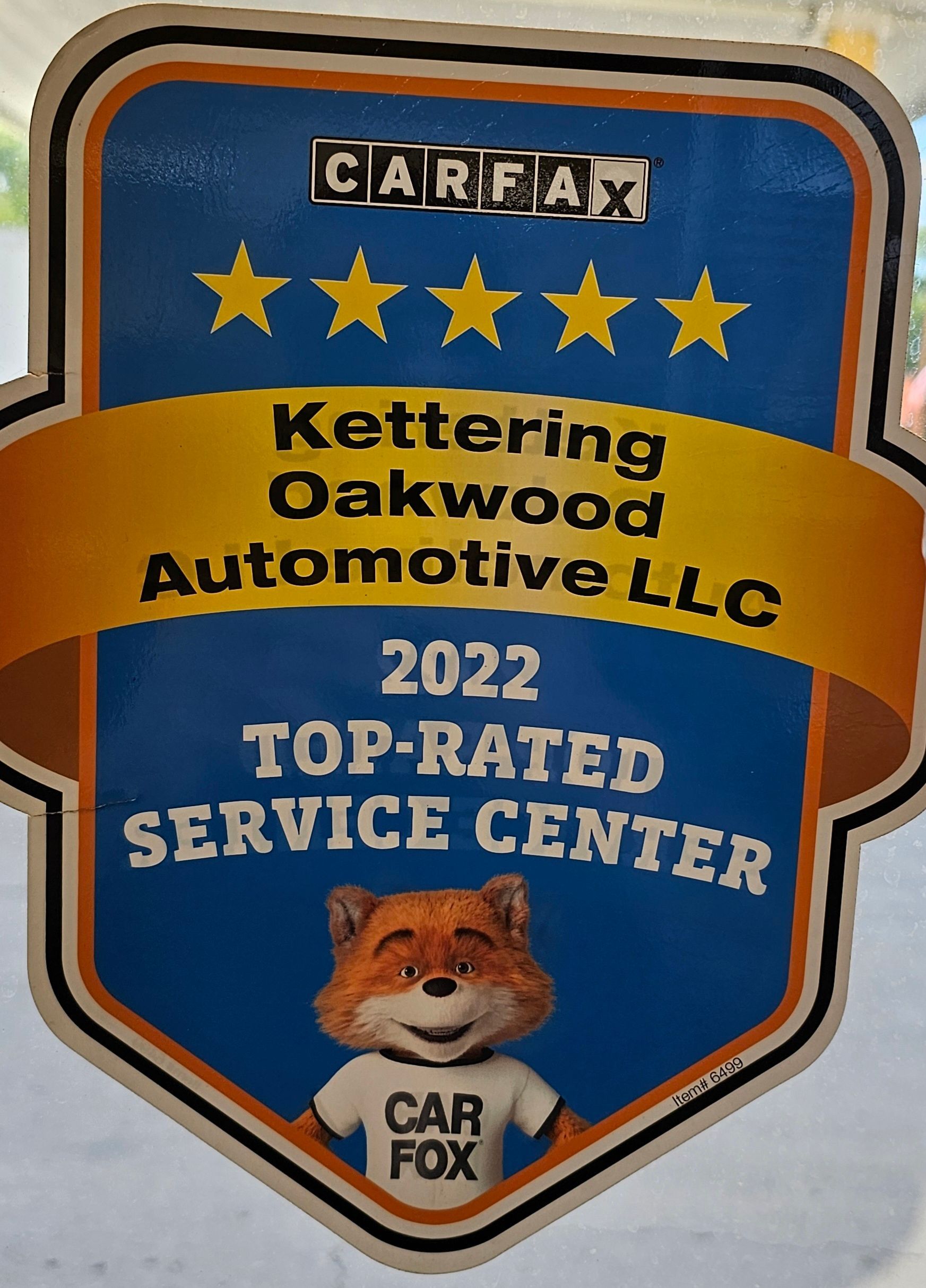 CARFAX Top-Rated Service Center award, blue/yellow, for Kettering Oakwood Automotive LLC, with CAR FOX mascot.