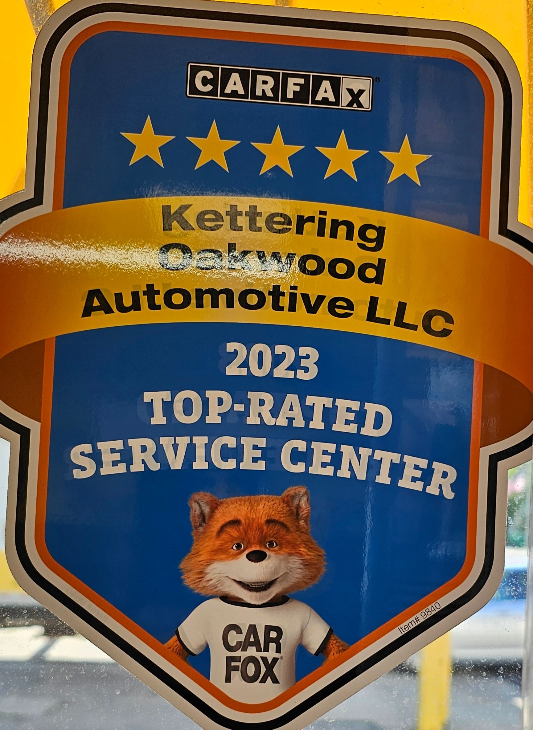 Carfax 2023 Top-Rated Service Center sticker: Kettering Oakwood Automotive. Features fox mascot, gold stars, and Carfax logo.