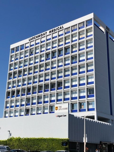Exterior of a multi-story medical building labeled “Lakewood Medical” under a clear blue sky