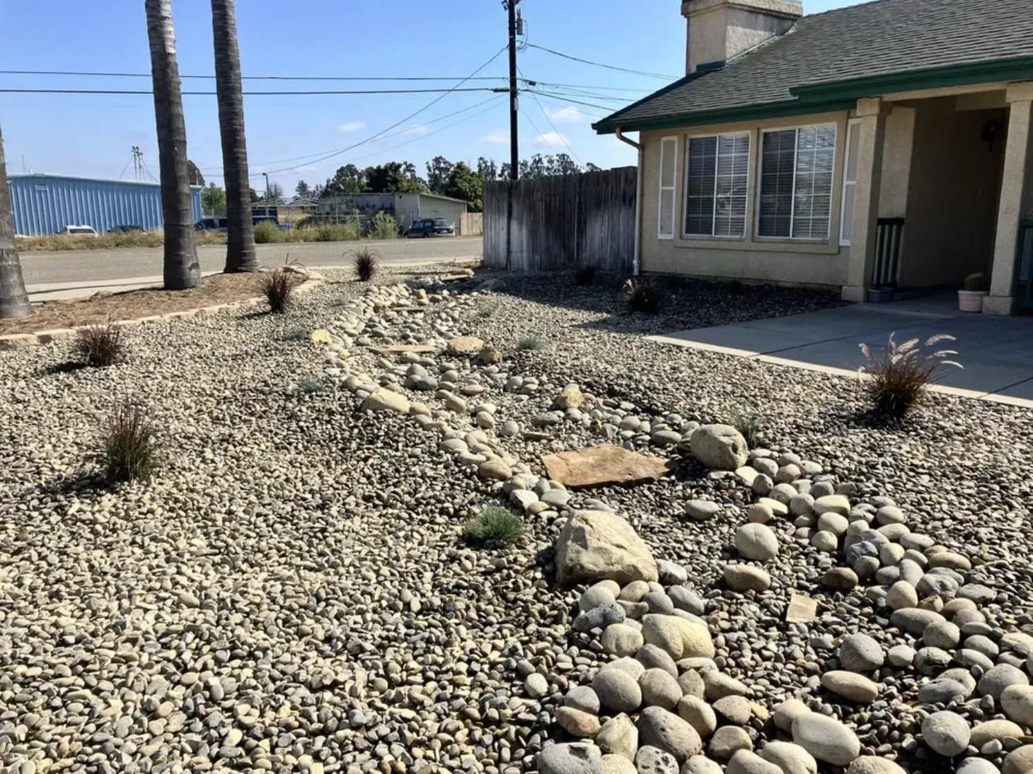 A house with a lot of rocks in front of it