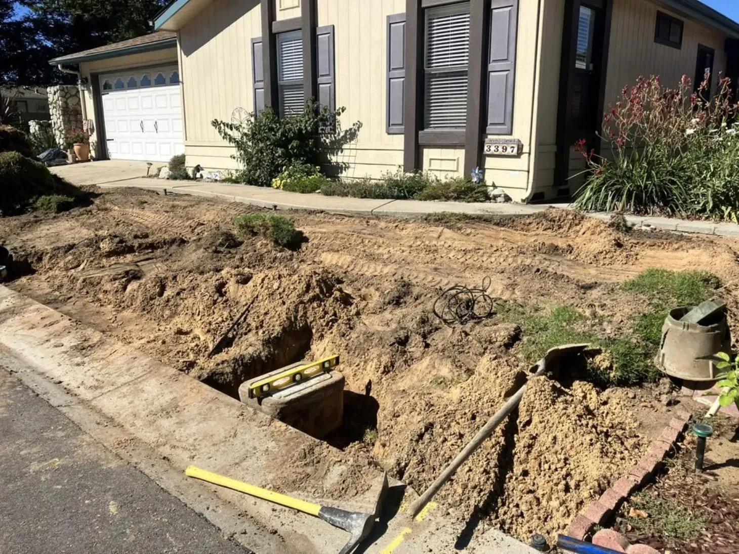 A house with a lot of dirt in front of it