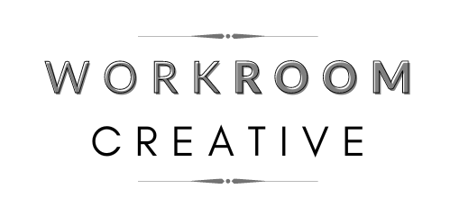 The logo for workroom creative is black and white.