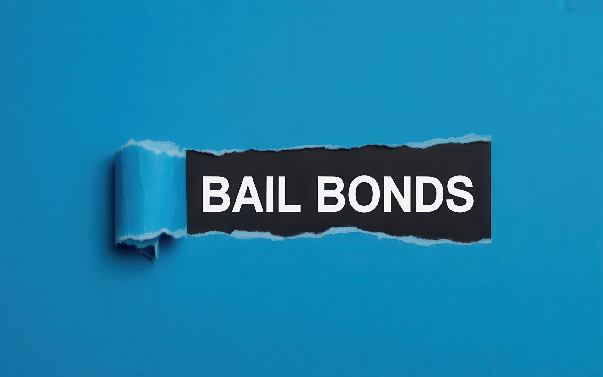 A torn blue paper reveals a black bail bonds sign with white text. A torn blue paper reveals a black bail bonds sign with white text.