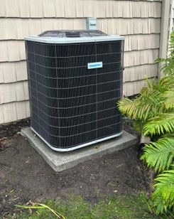 A house with a Comfortmaker air conditioning condenser. A house with a Comfortmaker air conditioning condenser.