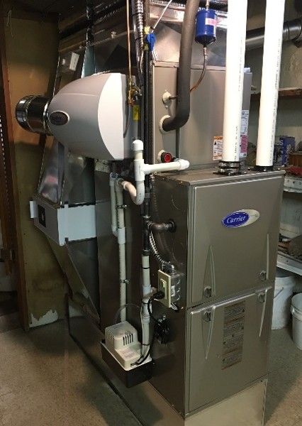 A home high efficiency furnace with a humidifier and air cleaner