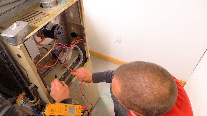 Technician testing furnace system.