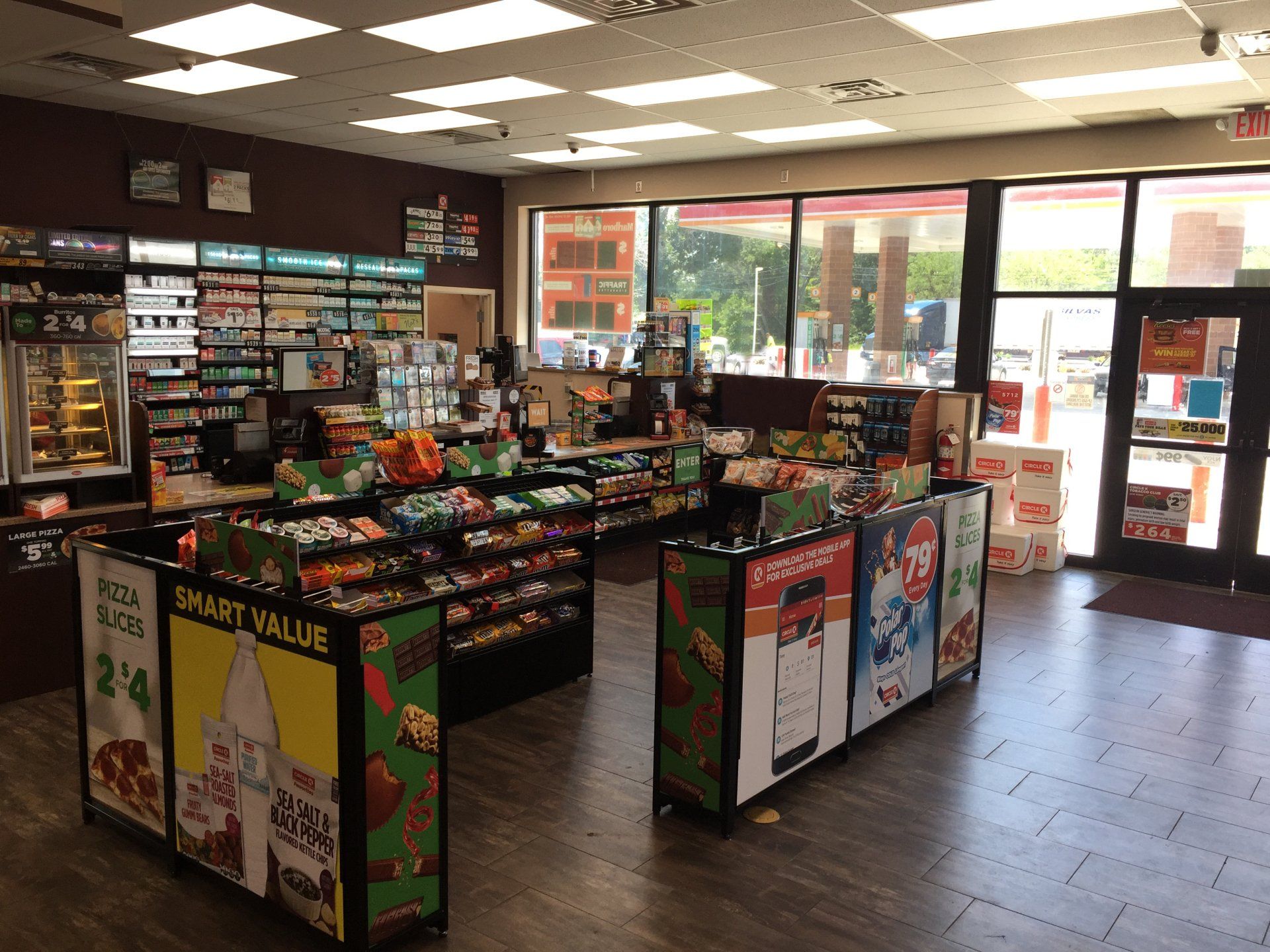 The inside of a gas station with a lot of shelves and displays.