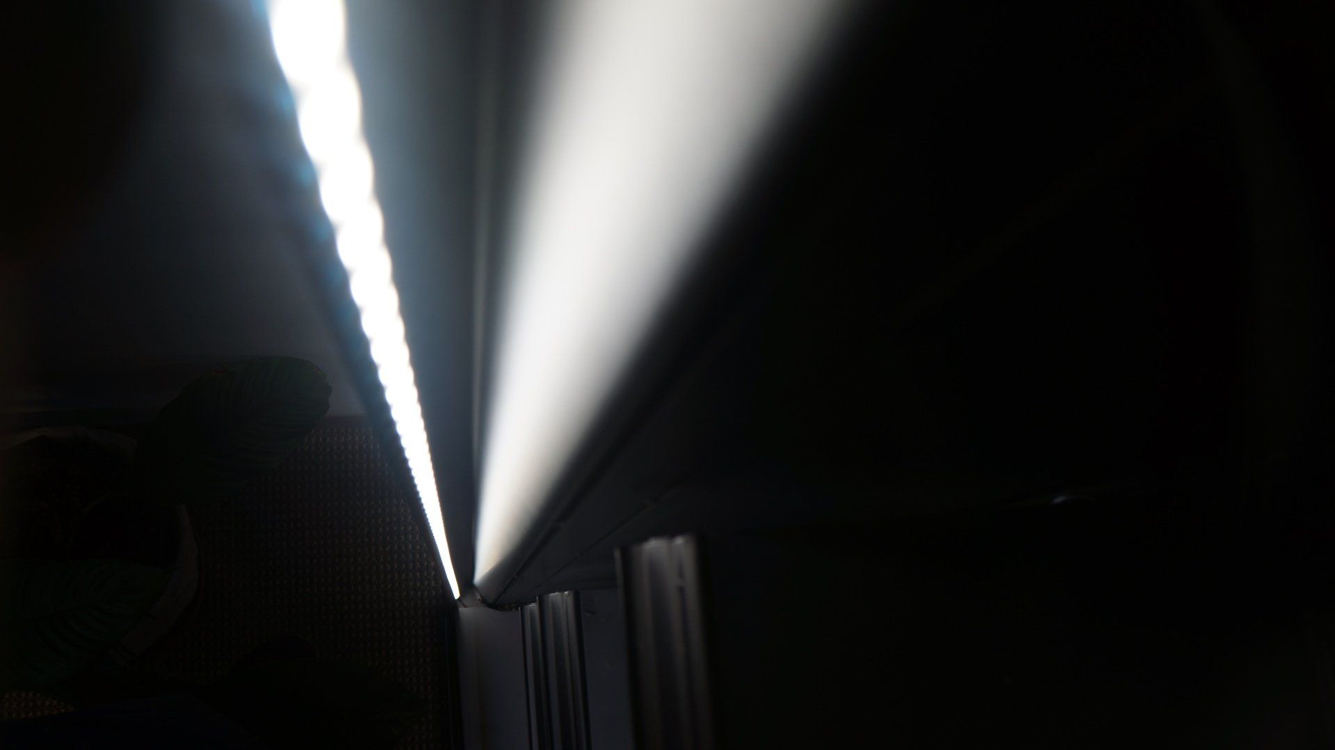 A beam of light is shining through a dark room