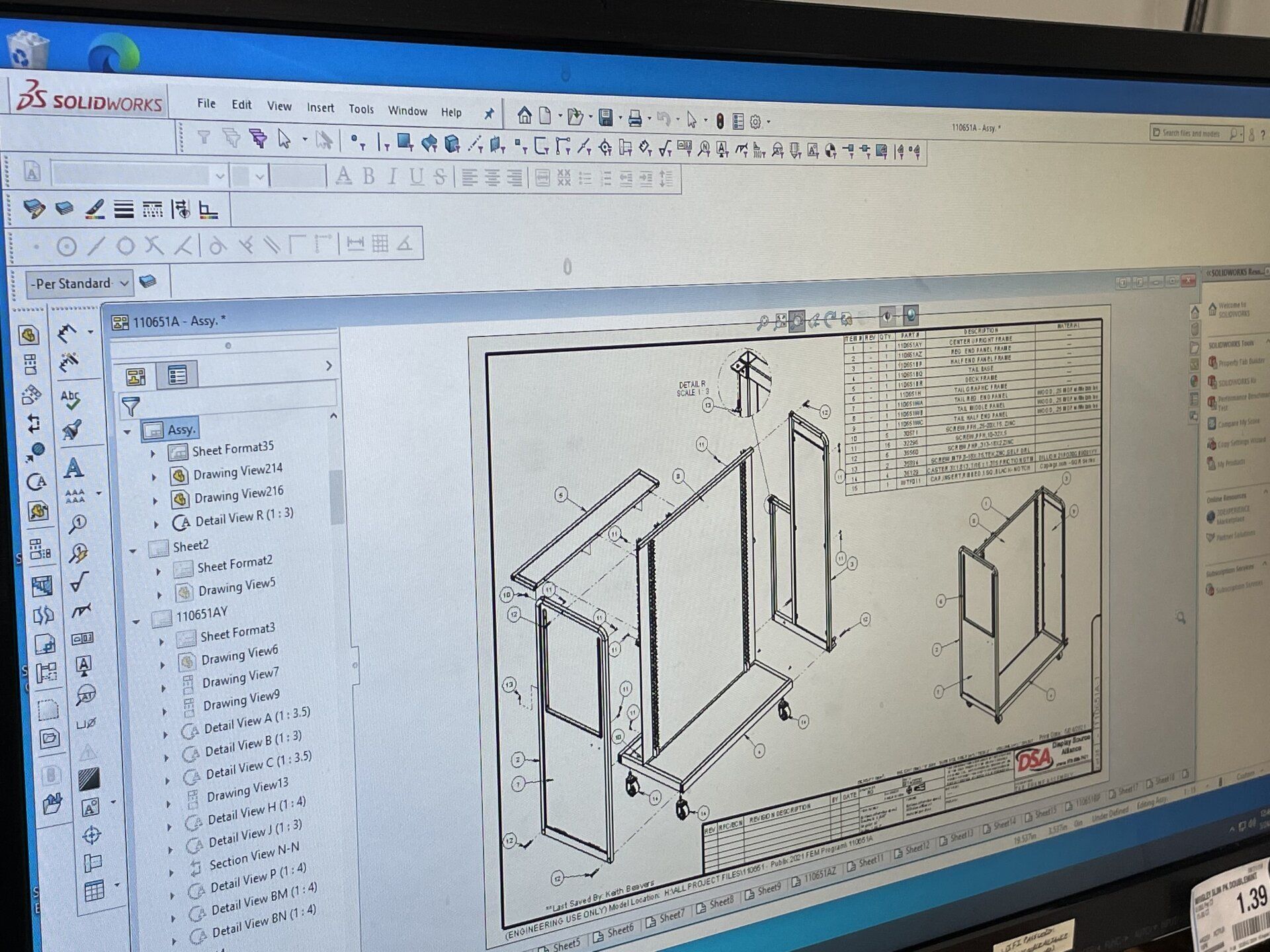 A computer screen shows a drawing of a piece of furniture