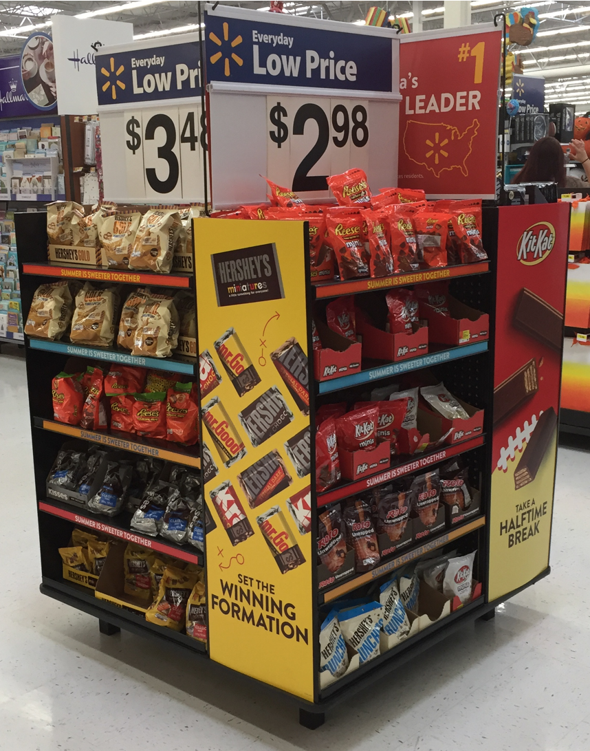 A display of snacks in a store with a low price of $ 2.98