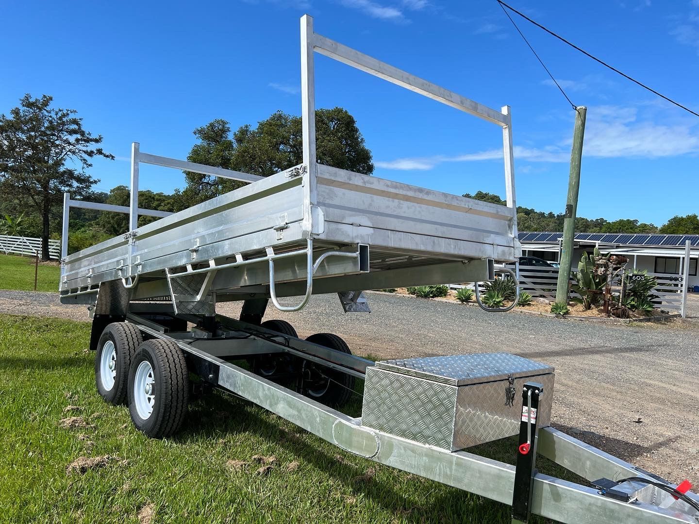 Silver Utility Trailer on Grass, With a Metal Frame — Rod's Engineering & Lifetime Trailers in Bli Bli, QLD