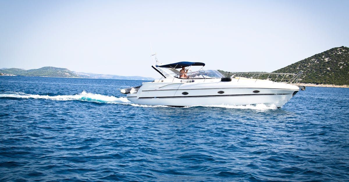 White Motorboat Cruising on Blue Water — Rod's Engineering & Lifetime Trailers in Bli Bli, QLD