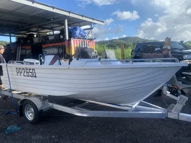 White Aluminum Boat on a Trailer, Parked Outside a Building — Rod's Engineering & Lifetime Trailers in Bli Bli, QLD