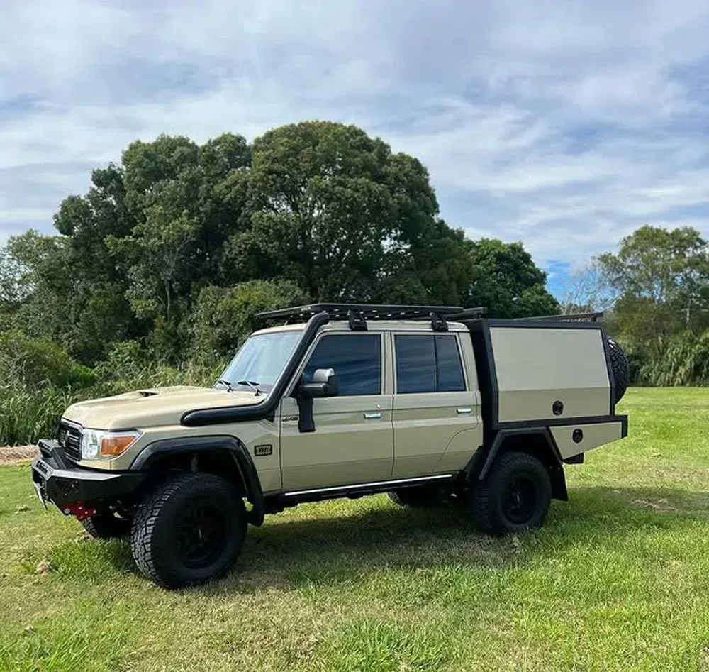 Tan Toyota Land Cruiser With a Black Roof Rack — Rod's Engineering & Lifetime Trailers in Bli Bli, QLD