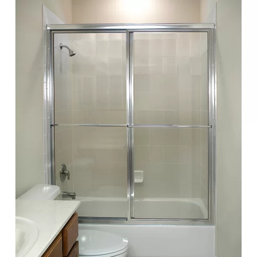 Shower stall with sliding glass doors, chrome frame, over a white bathtub.