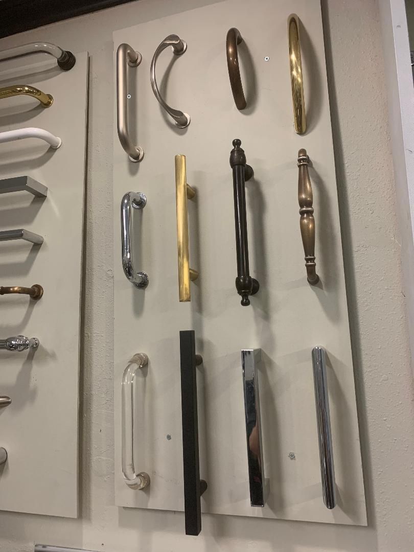 Door handles on display board, various styles and finishes.