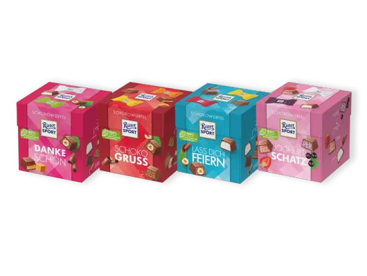 Vier verschiedene Ritter Sport Schokowürfel Boxen
