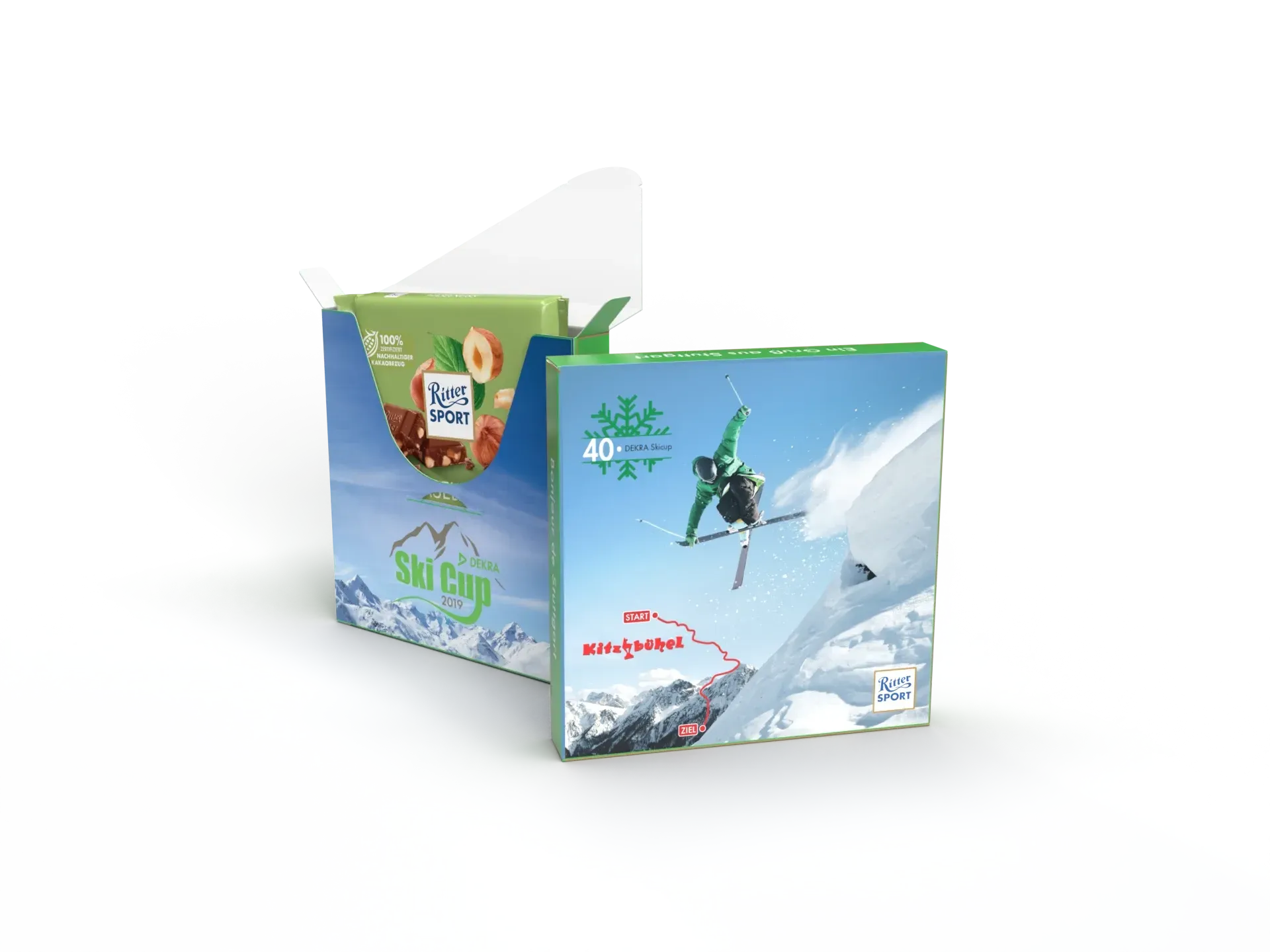 Schokoladen-Schachtel mit Skimotiv, die einen Snowboarder vor schneebedeckten Bergen und blauem Himmel zeigt.
