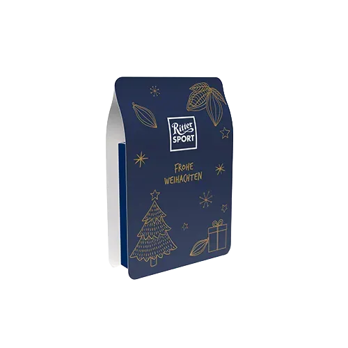 Blaue, festliche Geschenkbox mit goldenen Weihnachtsmotiven und dem „Ritter Sport“-Logo auf der Vorderseite