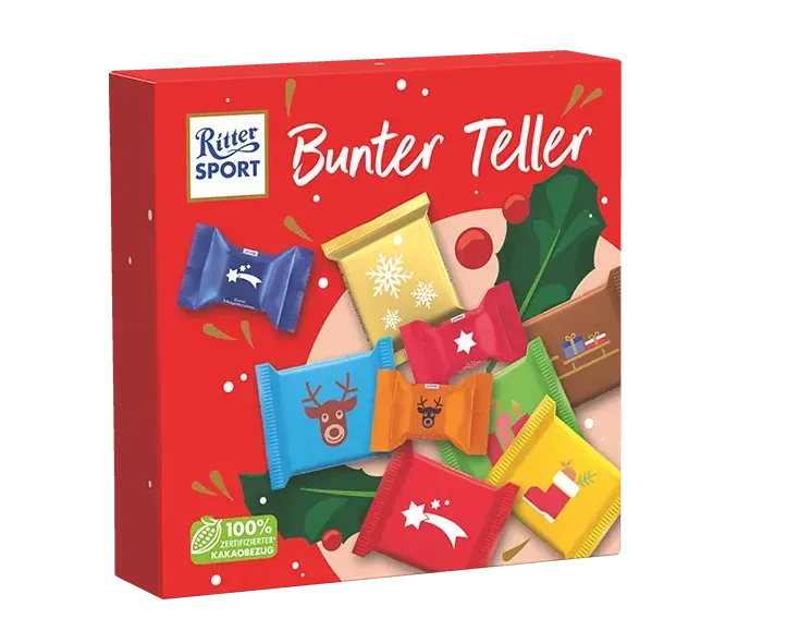 Ritter Sport Bunter Teller rote Snackbox mit verschiedenen bunt verpackten Leckereien