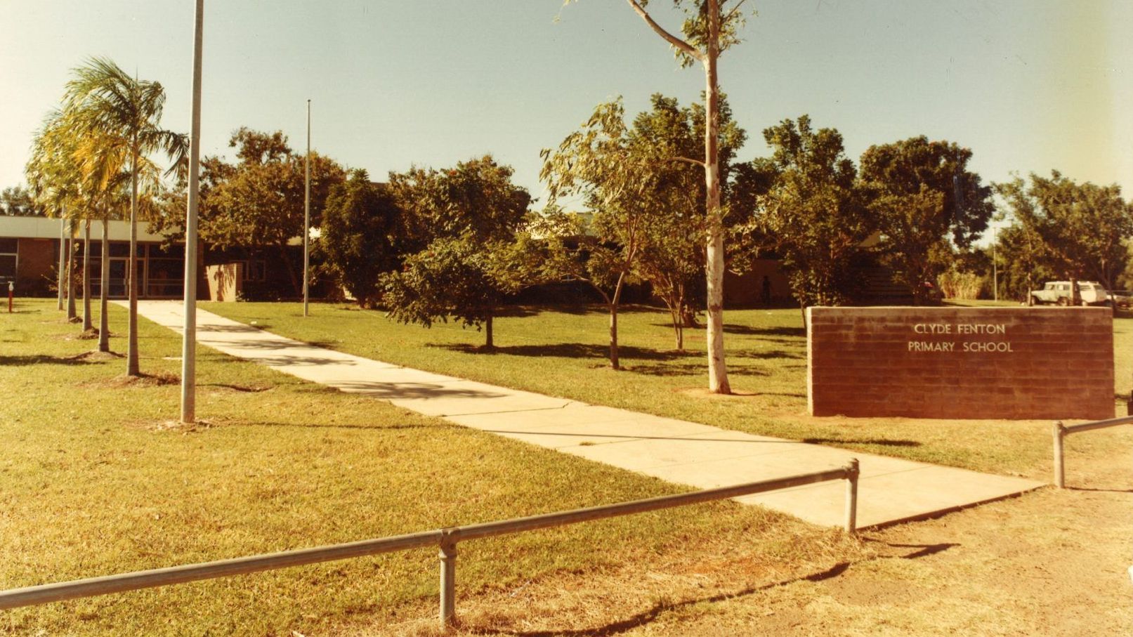A sign in a park that says ' clock tower ' on it
