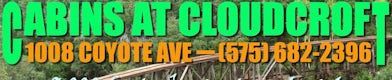 A sign for Cabins at Cloudcroft, located at 1008 Coyote Ave, phone (575) 682-2396, set against a woodsy background.
