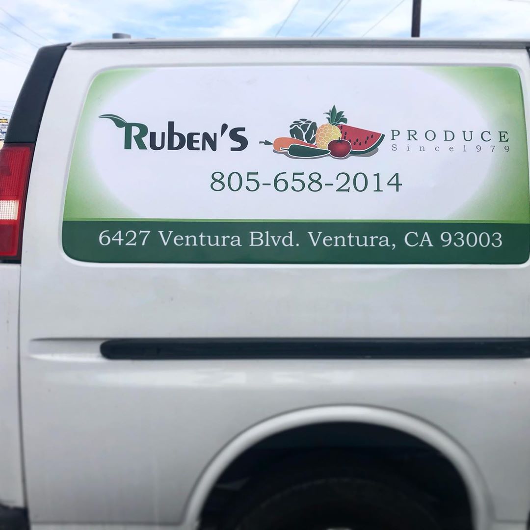 The back of a white van that says ruben 's produce