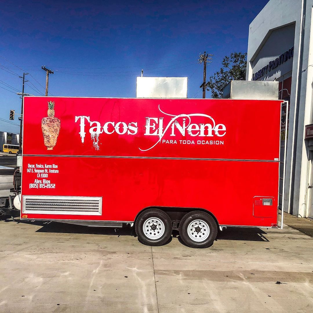 A red tacos el nene food truck is parked in a parking lot