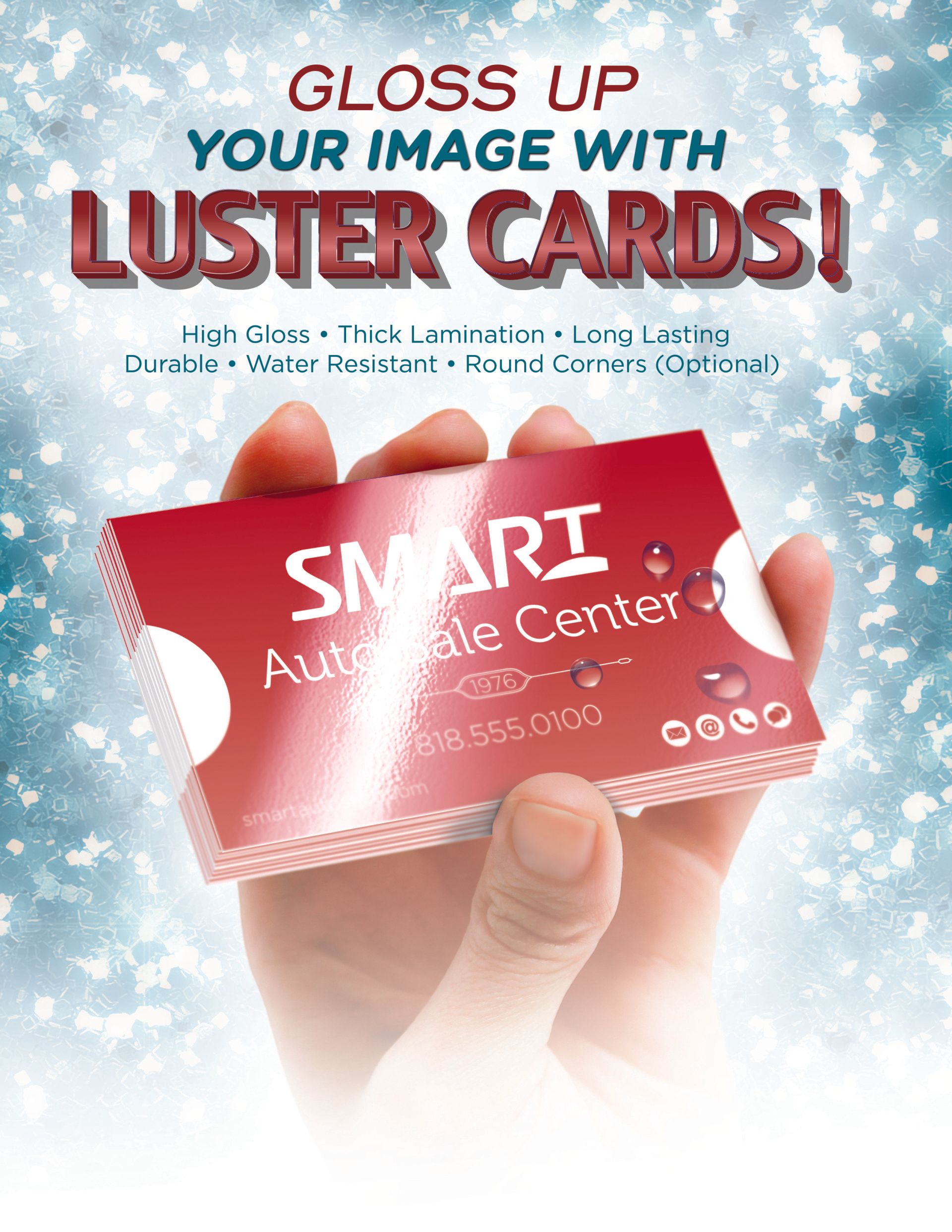 A person is holding a red business card in their hand.